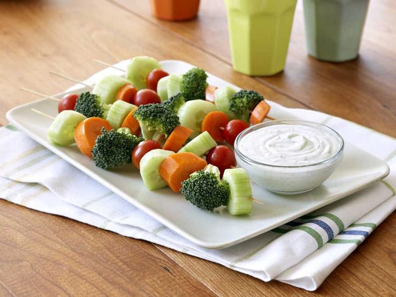 Plate with vegetable kebabs and ranch dressing